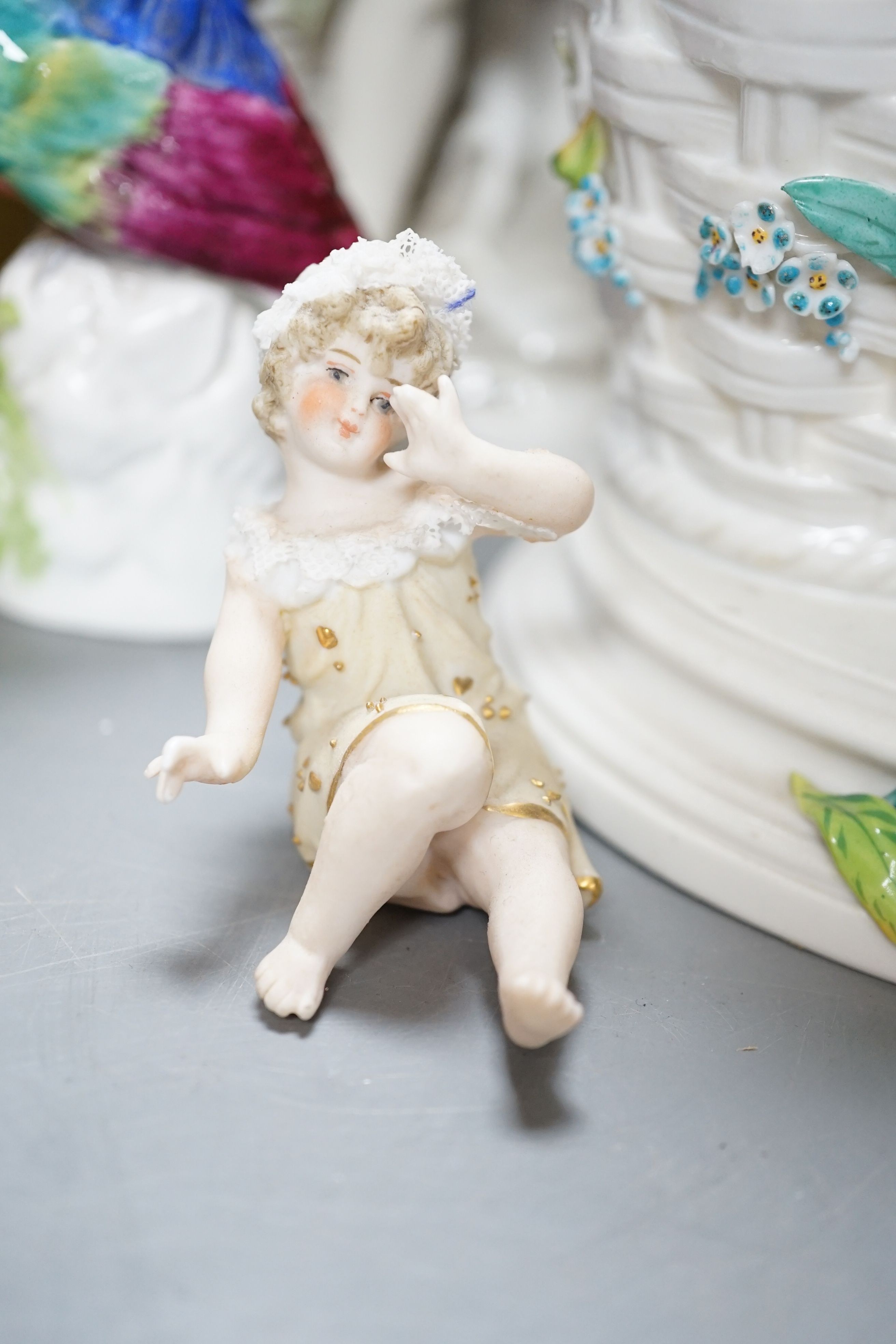 Ornamental china including uncommon three legged fairing, fairing 11 cms high, two continental porcelain groups, a Worcester figure the parakeet etc.